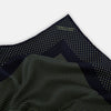 View 2 of product The Turnbull & Asser Navy and Melon Green Dot Silk Pocket Square features small melon green dots on navy silk with a solid border. One corner is folded over to highlight its exquisite handmade craftsmanship.