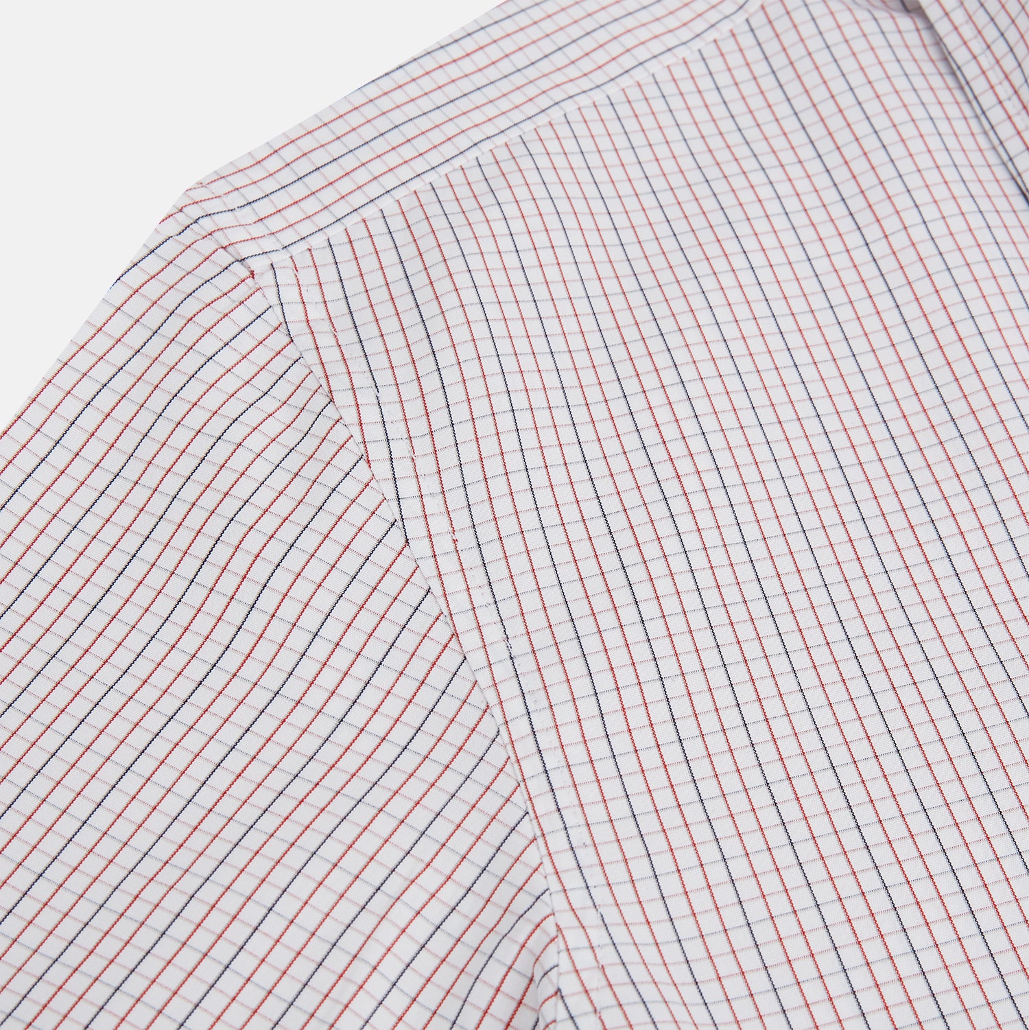View 6 of product The Turnbull & Asser Red and Navy Check Windsor Shirt features a pointed collar and cuffed long sleeves, highlighting British craftsmanship. Displayed flat on a white background.