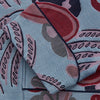 View 3 of product The Blue Paisley Pattern Cotton Arnold Gown by Turnbull & Asser features light blue jacquard cotton with a red and black paisley design, long sleeves, a matching belt, and two front pockets for a subtle Bloomsbury-inspired look.