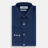 View 5 of product The Turnbull & Asser Navy Linen Mayfair Shirt features long sleeves, a button-up front with white buttons, pointed collar, buttoned cuffs, and a classic fit in solid dark blue linen, shown on a white background.