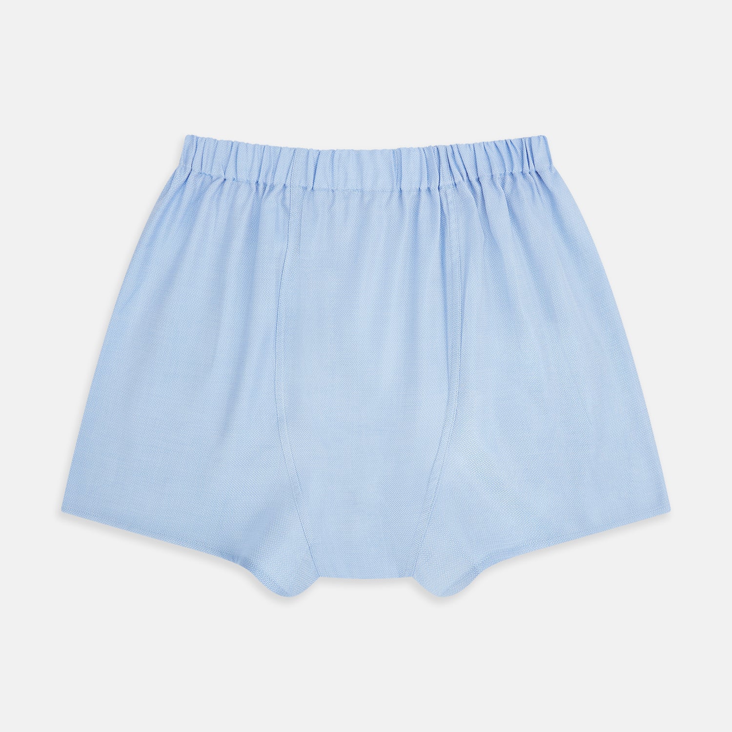 View 2 of product Plain Blue Godfrey Boxer Shorts by Turnbull & Asser, crafted from smooth Italian cotton. Featuring a light blue color and elastic waistband, these men's boxers are shown flat on a white background with a classic, pattern-free design.