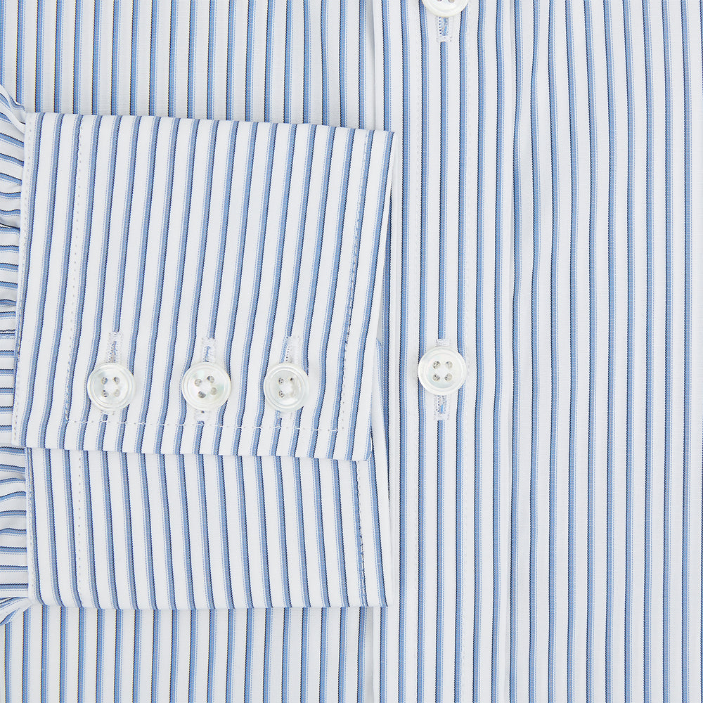 The Turnbull & Asser Blue Shadow Stripe Mayfair Shirt is a long-sleeve button-up with a T&A collar and thin blue vertical stripes on white, shown on a plain white background.