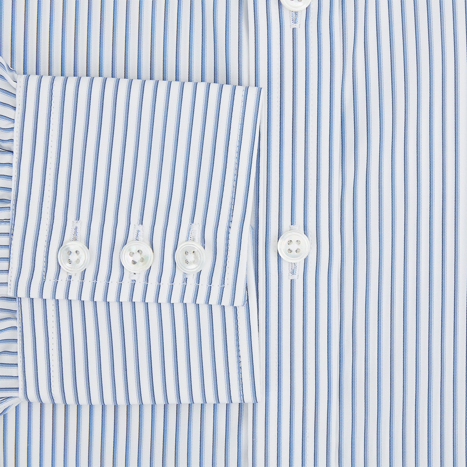 View 4 of product The Turnbull & Asser Blue Shadow Stripe Mayfair Shirt is a long-sleeve button-up with a T&A collar and thin blue vertical stripes on white, shown on a plain white background.