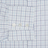 View 4 of product The Blue Overlay Grid Check Mayfair Shirt by Turnbull & Asser features a light blue and white grid check pattern with long sleeves and button-up design, making it a versatile wardrobe staple. Displayed on a plain white background.