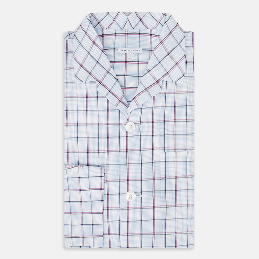 The Turnbull & Asser Burgundy and Blue Check Pyjama Shirt features a classic collar, button-up front, and grid check pattern—an elegant choice for nightwear or comfortable sleepwear.