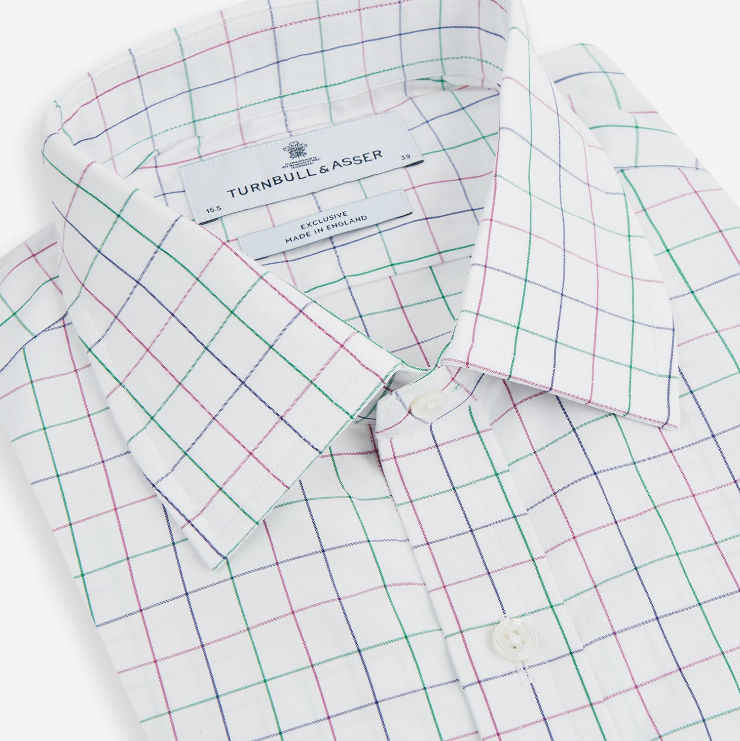 View 2 of product The Turnbull & Asser Pink Grid Check Mayfair Shirt is a long-sleeve, button-down shirt with a T&A collar, crafted from organic cotton and featuring a pink checkered grid pattern on white with buttoned cuffs.