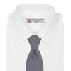 View 2 of product The Turnbull & Asser White and Black Houndstooth Woven Silk Tie, shown rolled on a light grey background, adds a classic touch to any smart outfit.