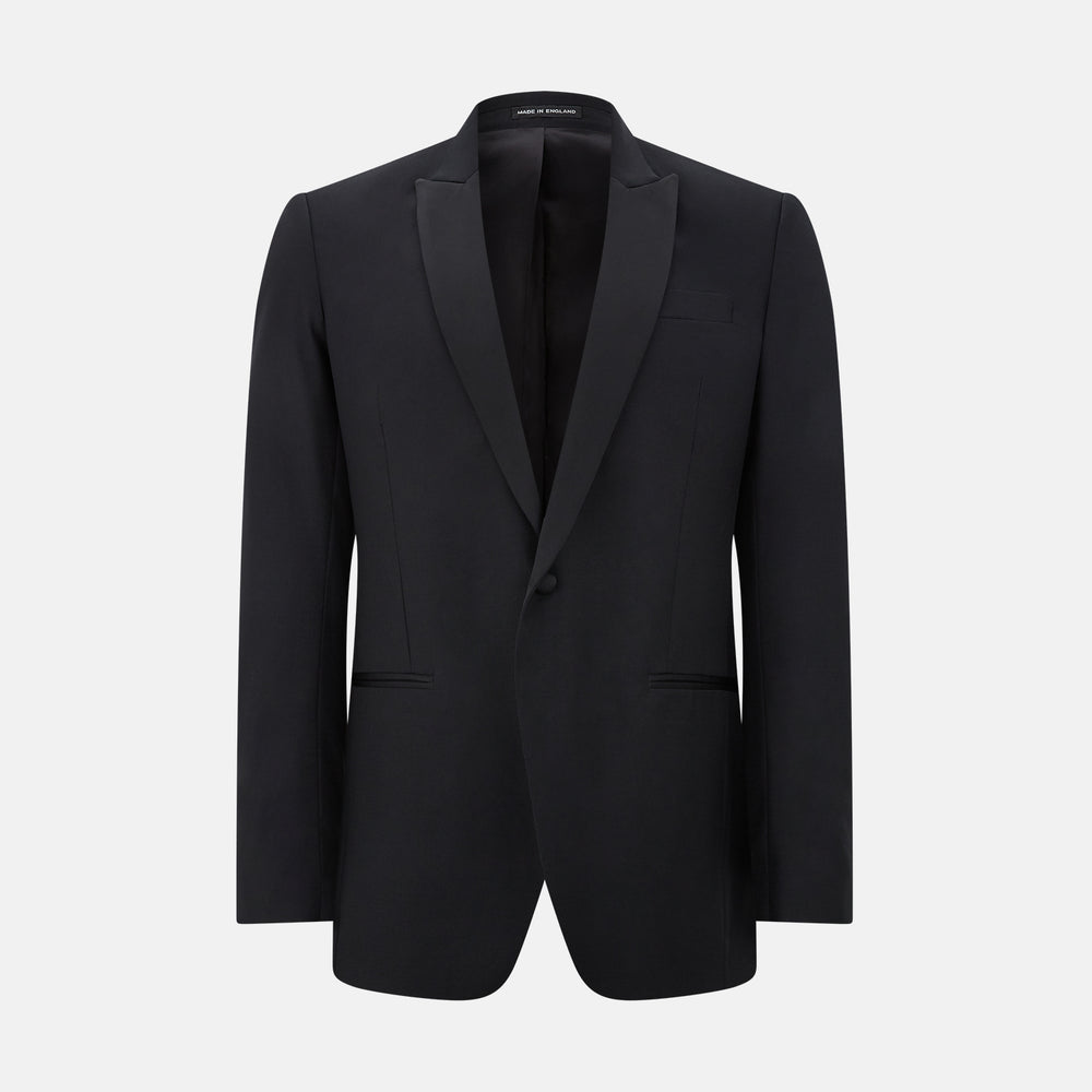 The Turnbull & Asser Black Single Breasted Dinner Suit features fine wool, a satin shawl collar jacket, and matching trousers—perfect formal wear, shown on a plain white background.