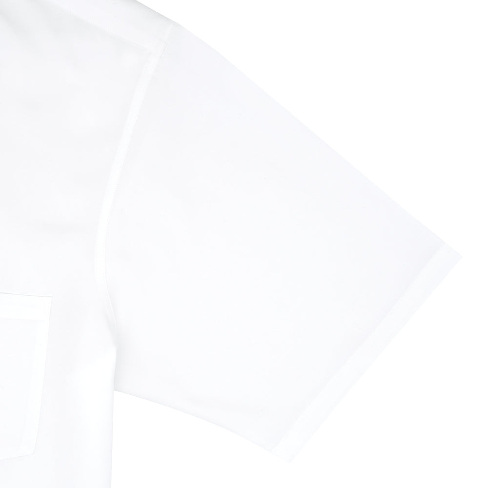 The White Lyocell Hampton Open Collar Shirt by Turnbull & Asser is neatly folded with visible label, notched collar, and buttons, displayed against a light grey background.