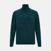 View 1 of product The Turnbull & Asser Hunter Green Half-Zip Cashmere Jumper is a classic knitwear pullover with long sleeves, a high mock neck, half-zip closure, and ribbed cuffs and hem, shown against a plain white background.