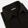 View 2 of product A brown Rugby Polo Shirt by Turnbull & Asser, made of pure cotton with long sleeves, a collar, and a short buttonless placket, is laid flat on a white background.