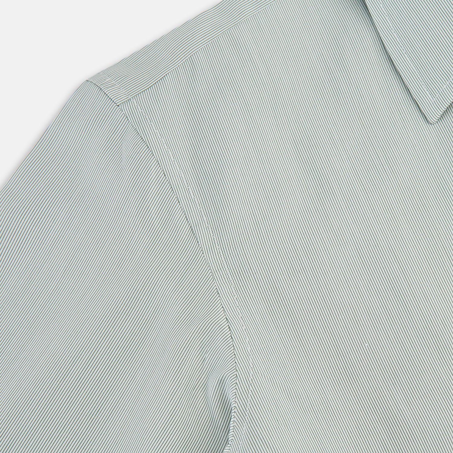View 6 of product A dark green hairline stripe Westminster shirt by Turnbull & Asser, featuring long sleeves, a classic collar, tailored fit, white front buttons, and buttoned cuffs, laid flat on a white background.