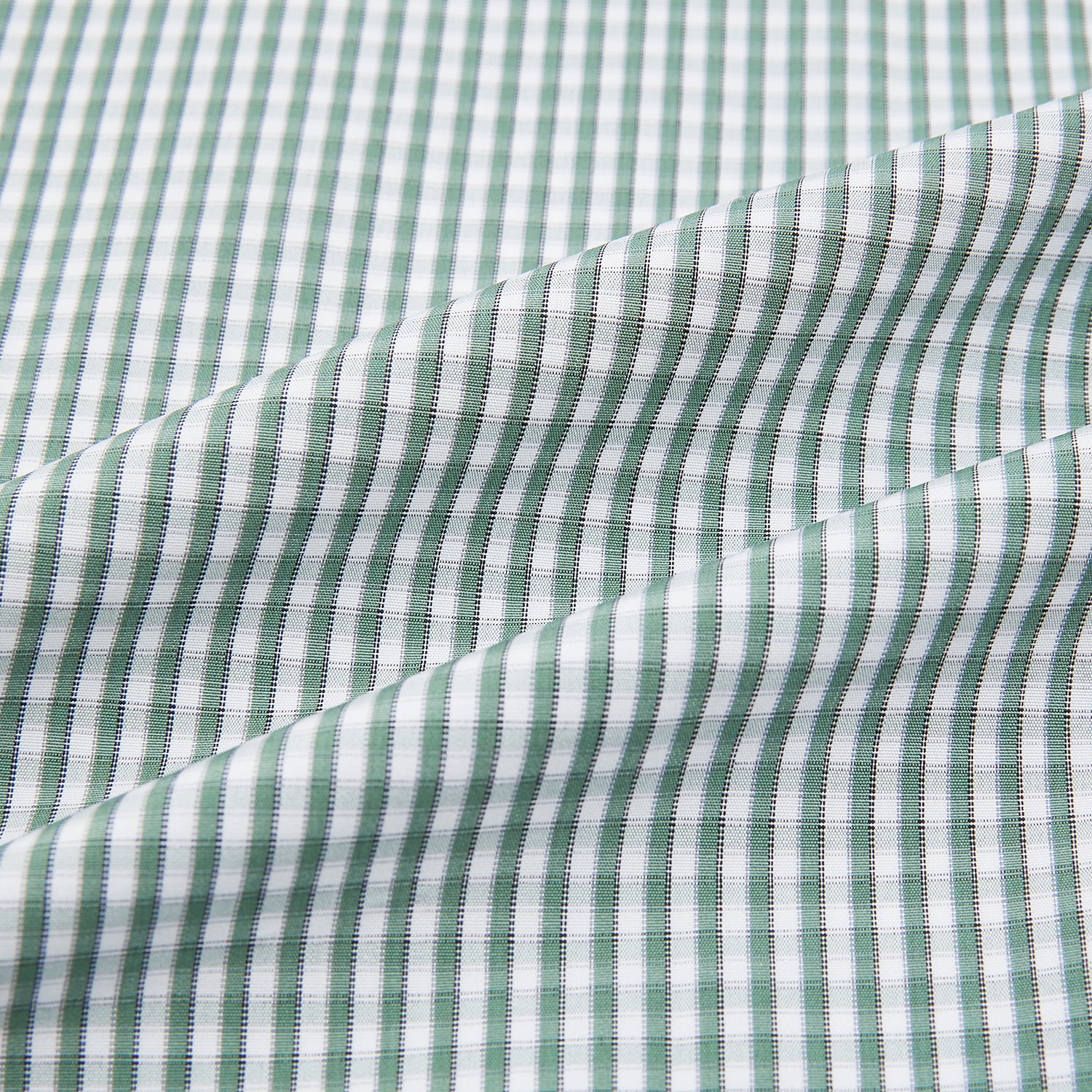 View 6 of product The Turnbull & Asser Green Fine Check Mayfair Shirt, crafted from fine Italian cotton with a pointed collar and buttoned cuffs, is shown laid flat on a white background.
