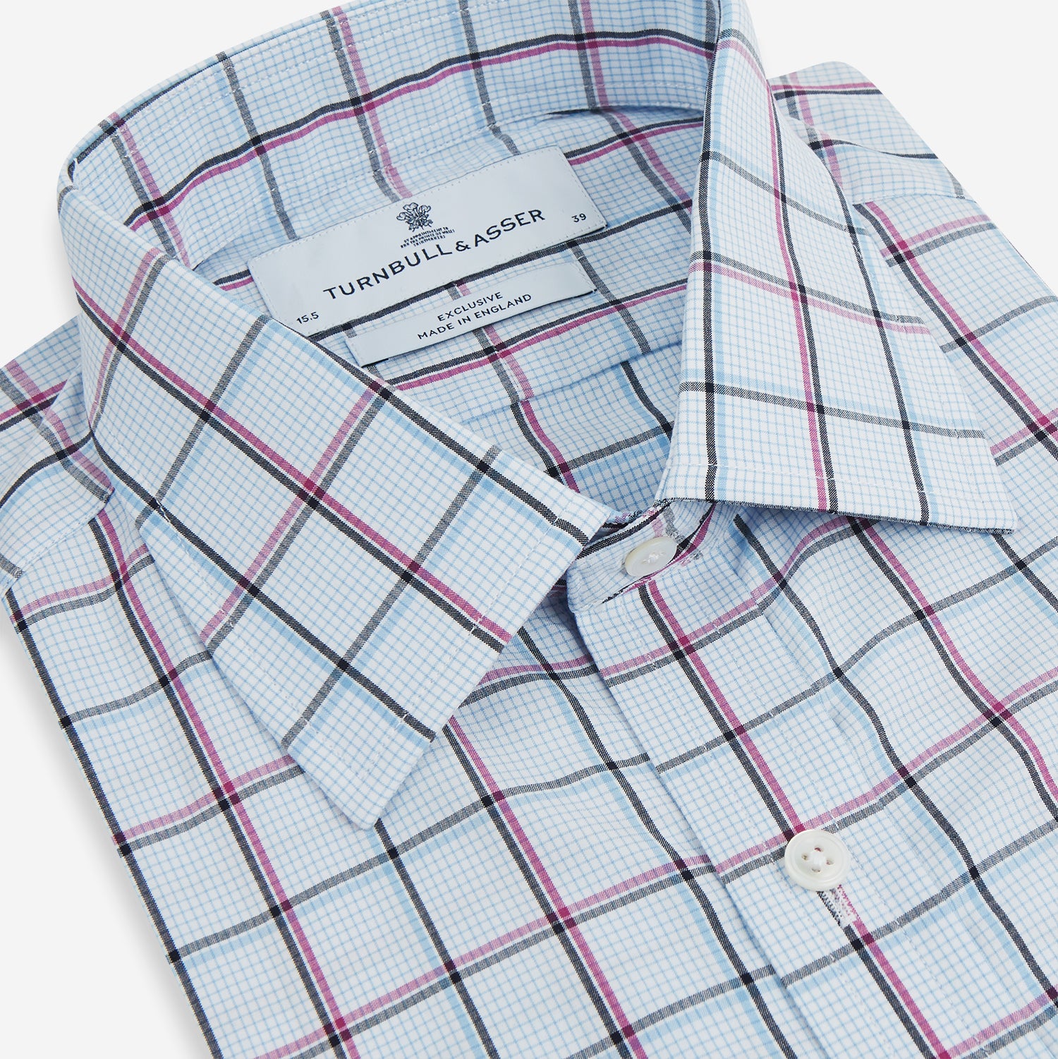 View 2 of product The Turnbull & Asser Blue and Pink Tattersall Check Mayfair Shirt features a classic tattersall pattern with a T&A collar and cuffed sleeves.