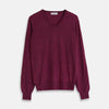 View 1 of product The Turnbull & Asser Plum Fine Merino V-Neck Jumper is a lightweight, long-sleeved layer in deep burgundy, featuring ribbed cuffs and hem for a refined finish, displayed against a white background.