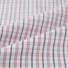 View 6 of product The Turnbull & Asser Red and Blue Multi Check Mayfair Shirt is a long-sleeve button-down made from Italian cotton with a white base and a light red and blue check pattern, shown laid flat on a white background.
