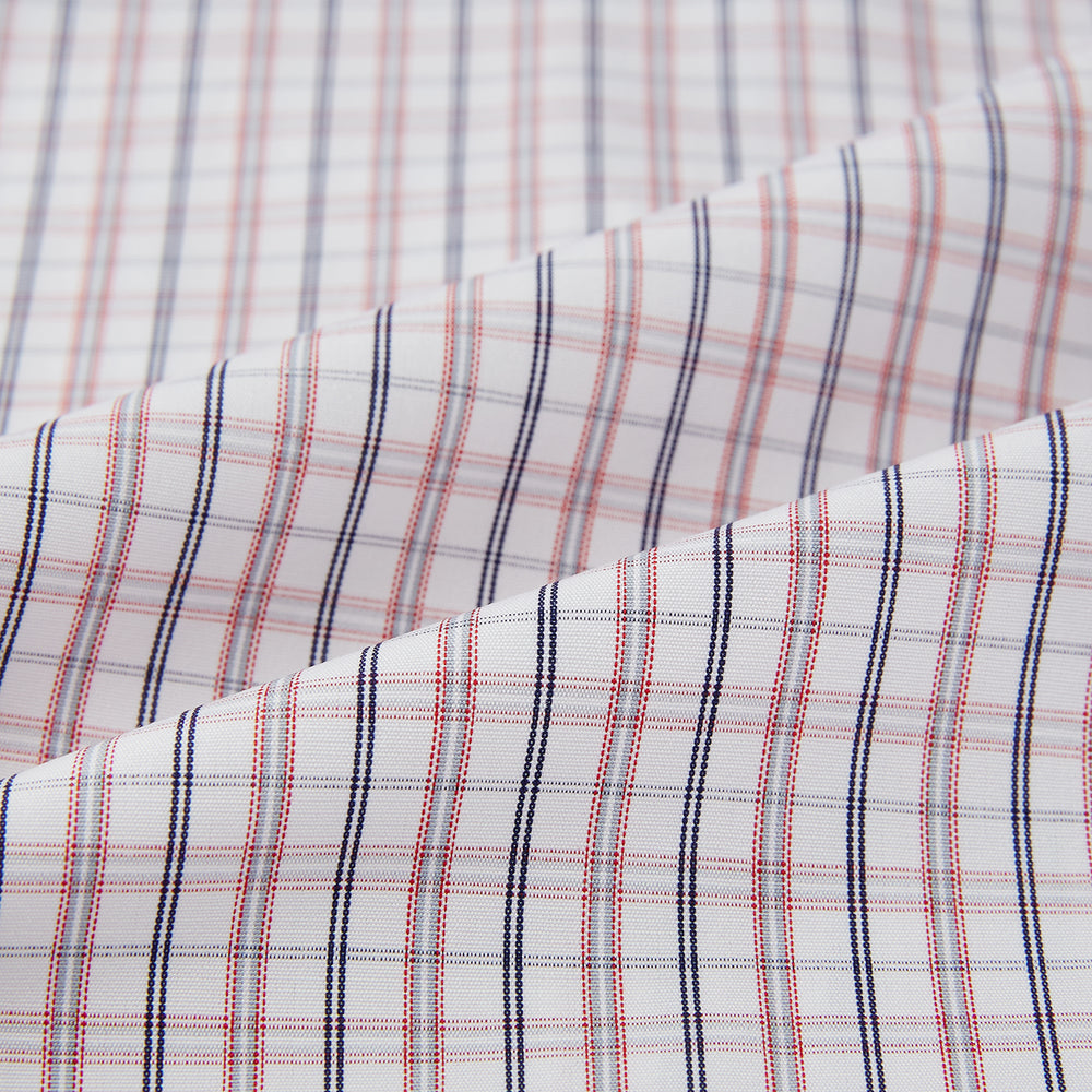 The Turnbull & Asser Red and Blue Multi Check Mayfair Shirt is a long-sleeve button-down made from Italian cotton with a white base and a light red and blue check pattern, shown laid flat on a white background.