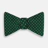View 1 of product The Turnbull & Asser Racing Green and White Spot Silk Bow Tie features small white polka dots on luxurious silk, shown against a plain white background.