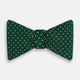 The Turnbull & Asser Racing Green and White Spot Silk Bow Tie features small white polka dots on luxurious silk, shown against a plain white background.