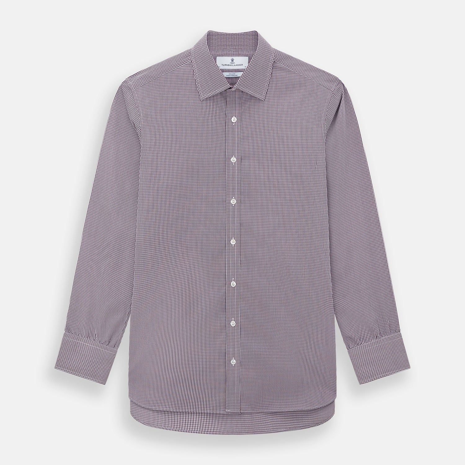 View 1 of product The Turnbull & Asser Burgundy Micro Check Mayfair Shirt features long sleeves, a pointed collar, and white buttons—perfect for formal wear. Shown laid flat on a white background.