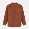 View 5 of product The Turnbull & Asser Rust Cotton Weekend Fit Blake Shirt features long sleeves, a stand collar, and white buttons—an ideal casual piece displayed flat on a white background.
