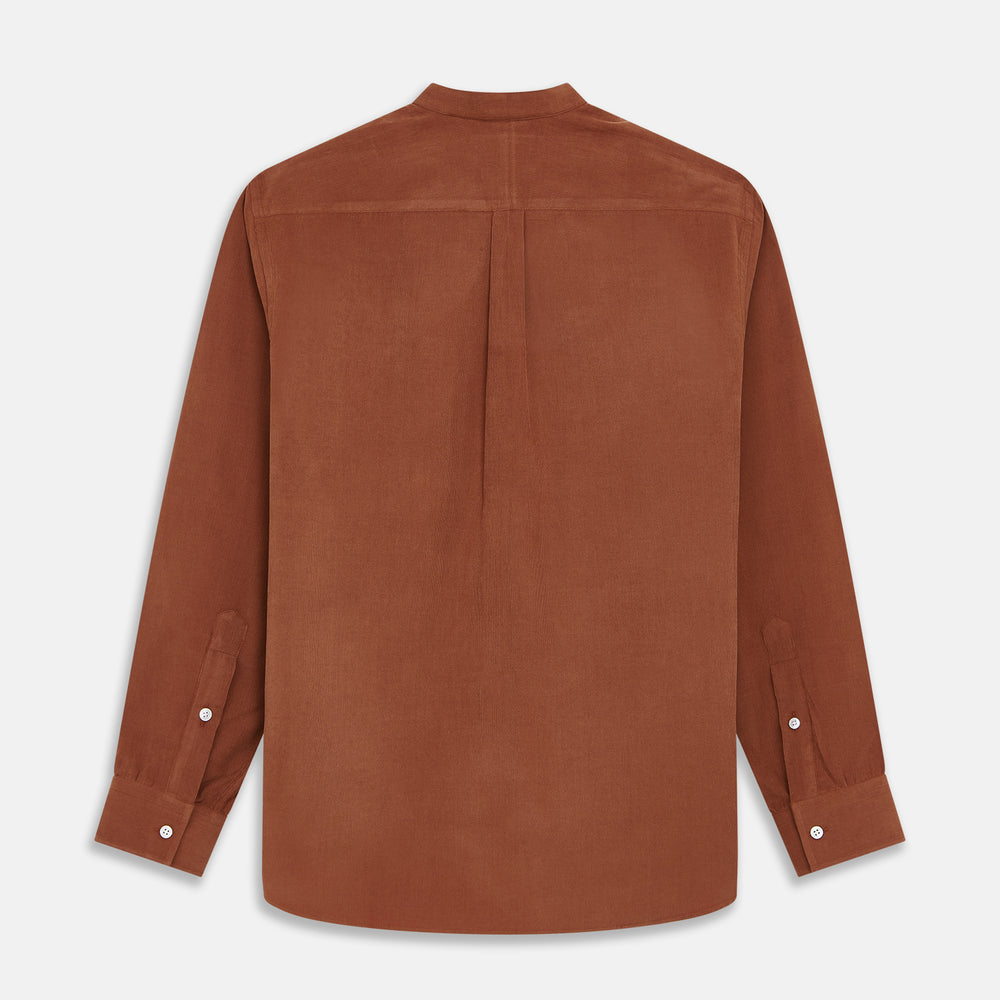 The Turnbull & Asser Rust Cotton Weekend Fit Blake Shirt features long sleeves, a stand collar, and white buttons—an ideal casual piece displayed flat on a white background.