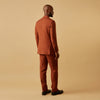 View 8 of product The Turnbull & Asser Rust Linen-Wool-Silk Bertie Blazer is a red double-breasted jacket with peak lapels, black buttons, and flap pockets, tailored in Italy from a luxury linen-wool-silk blend and shown on a white background.