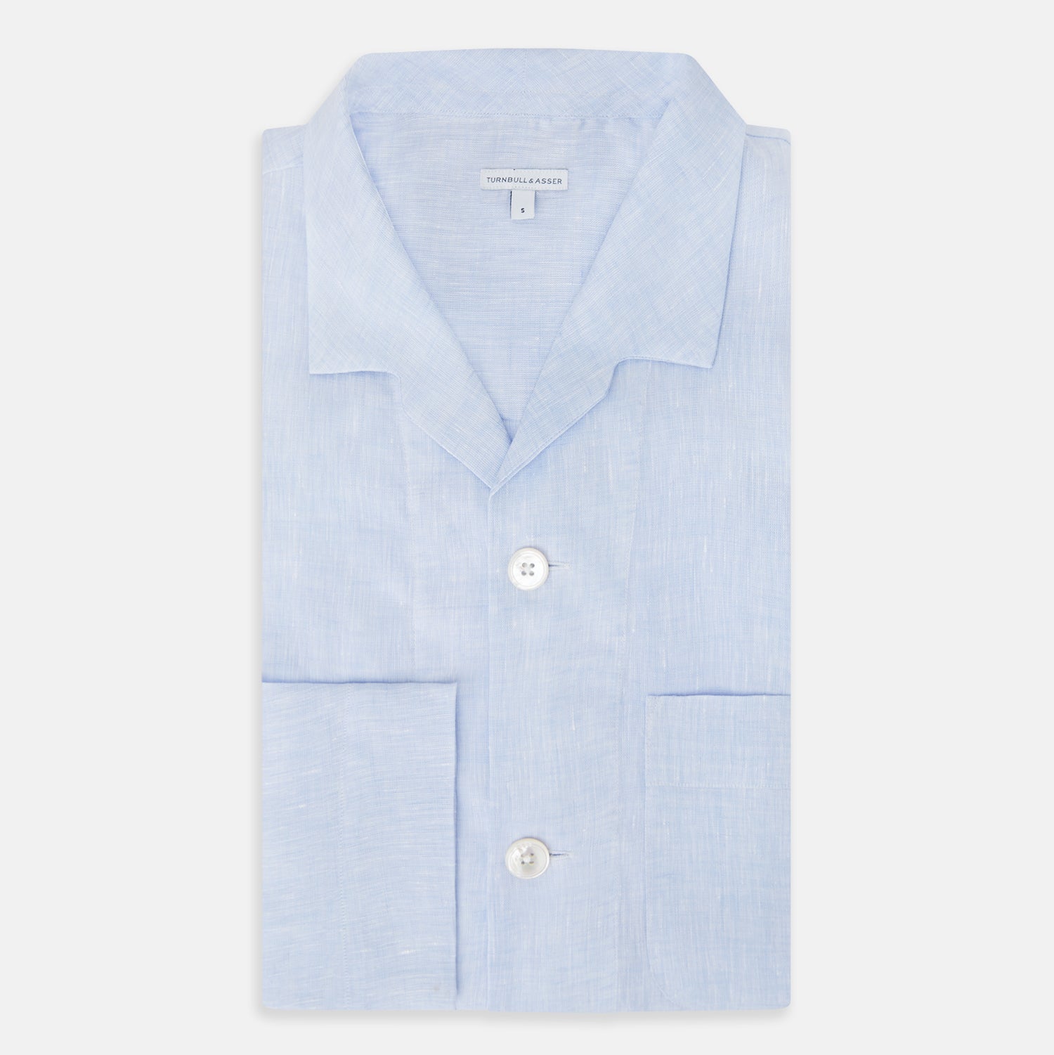 View 5 of product The Turnbull & Asser Pale Blue Linen Pyjama Shirt features long sleeves, a collar, front buttons, and a chest pocket—perfect as elegant loungewear or nightwear.