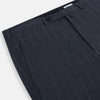 View 2 of product The Navy Striped Edmund trousers by Turnbull & Asser have a relaxed, straight-leg fit with front pleats, belt loops, and a single button waist closure, shown against a plain white background.