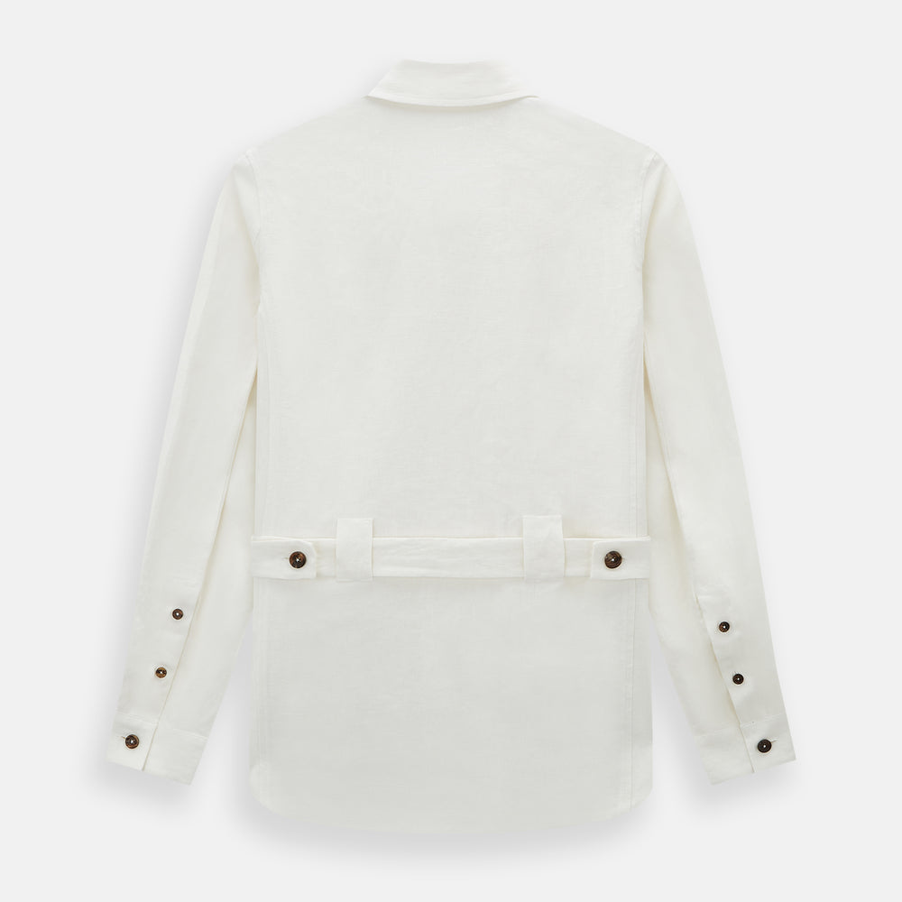 The Vanilla Linen Holland Shacket by Turnbull & Asser, a white Irish linen button-up with a collar, brown buttons, and four pockets, is laid flat on a white background—perfect as lightweight outerwear.