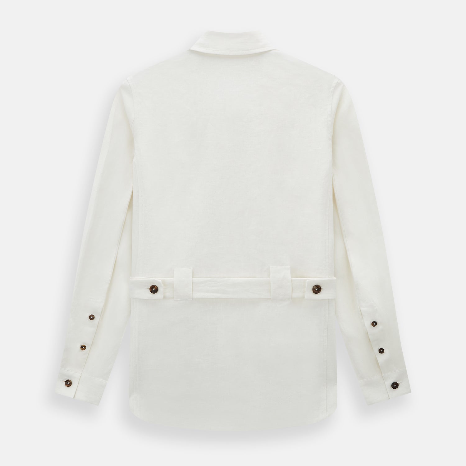 View 3 of product The Vanilla Linen Holland Shacket by Turnbull & Asser, a white Irish linen button-up with a collar, brown buttons, and four pockets, is laid flat on a white background—perfect as lightweight outerwear.