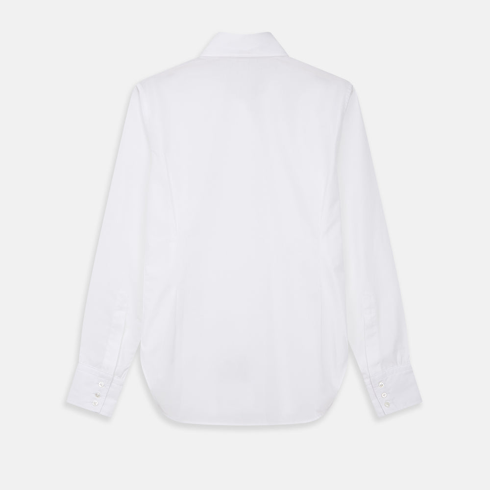 The White Cotton Lauren Shirt by Turnbull & Asser, featuring a stand collar, button-down front, and elongated body, is laid flat on a plain white background.