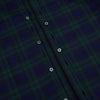 View 7 of product The Turnbull & Asser Black Watch Tartan Windsor Shirt is a long-sleeve, button-up shirt with a dark green and navy tartan pattern, white buttons, collar, and curved hem—showcasing British craftsmanship on a plain white background.