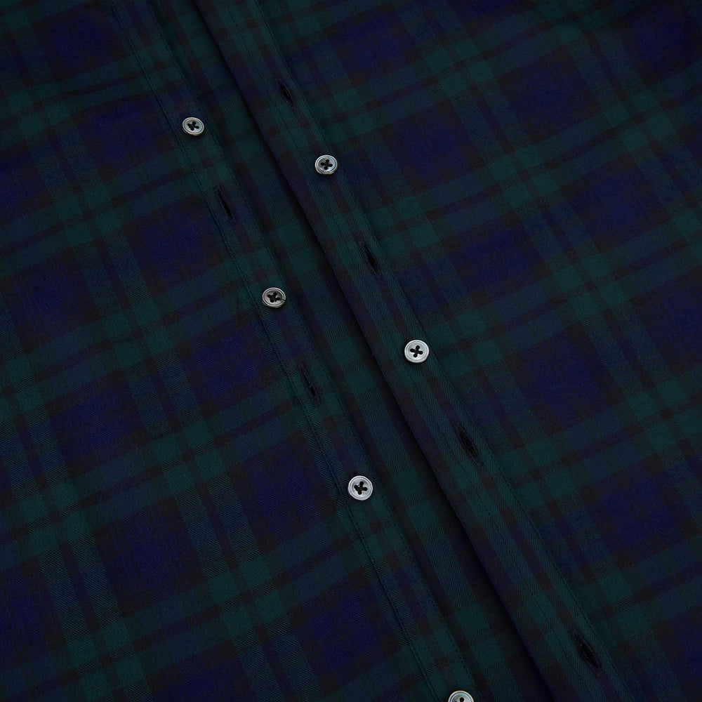 The Turnbull & Asser Black Watch Tartan Windsor Shirt is a long-sleeve, button-up shirt with a dark green and navy tartan pattern, white buttons, collar, and curved hem—showcasing British craftsmanship on a plain white background.