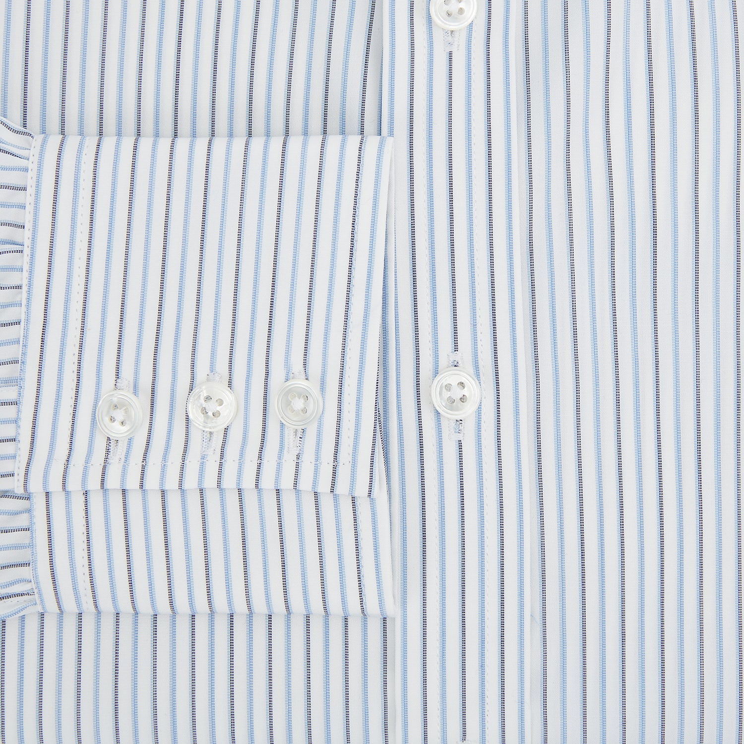 View 4 of product The Turnbull & Asser Navy and Blue Shadow Stripe Mayfair Shirt, featuring a classic T&A collar and buttoned cuffs, is laid flat on a white background.