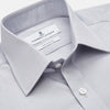 View 2 of product The Turnbull & Asser Faded Blue Block Check Cotton Regular Fit Mayfair Shirt, featuring long sleeves, a classic collar, and white buttons, is neatly laid flat on a white background.