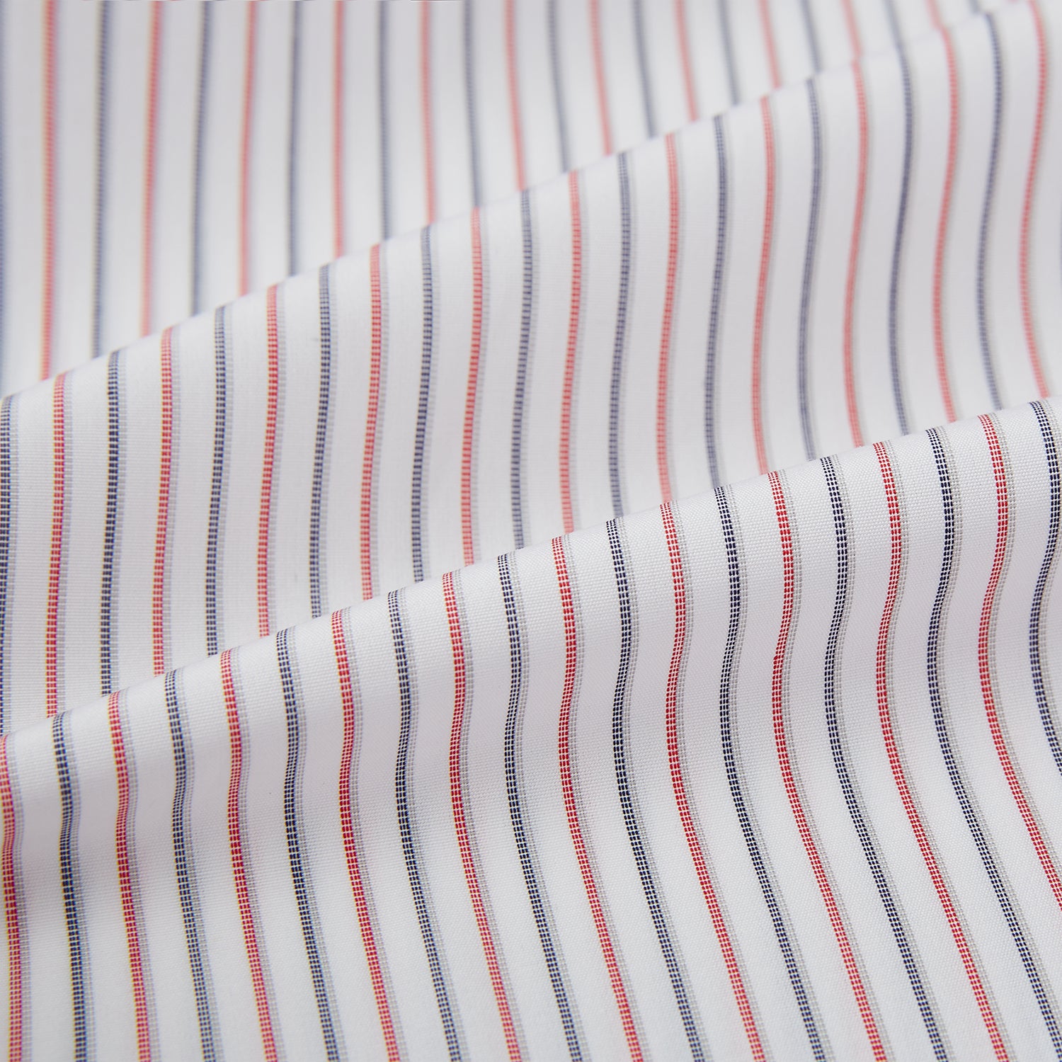 View 8 of product The Turnbull & Asser Red and Blue Double Stripe Westminster Shirt is a long-sleeved, button-up dress shirt with a formal collar, featuring narrow red and blue stripes on white, shown against a plain white background.