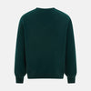 View 3 of product The Turnbull & Asser Forest Green Cashmere V-neck Jumper features ribbed cuffs and hem, shown against a white background—an essential knitwear staple for any wardrobe.