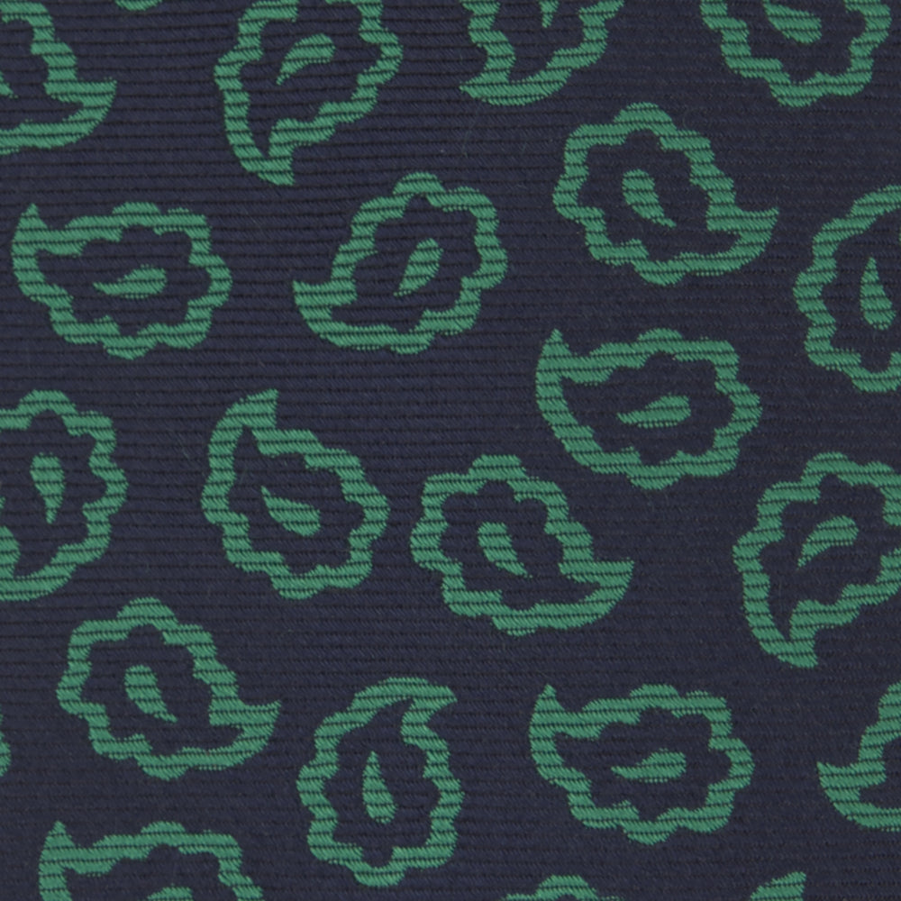 The Turnbull & Asser Navy and Green Petal Paisley Silk Tie is a stylish accessory, featuring timeless paisley motifs on silk, making it an elegant addition to any wardrobe.