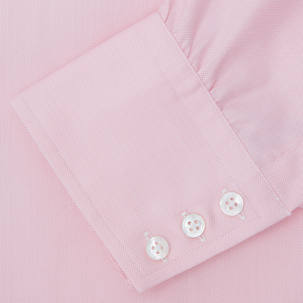 View 4 of product The Turnbull & Asser Pink Royal Oxford Cotton Shirt features a button-down collar and 3-button cuffs, ideal for men's weekend wear. Displayed against a plain white background.
