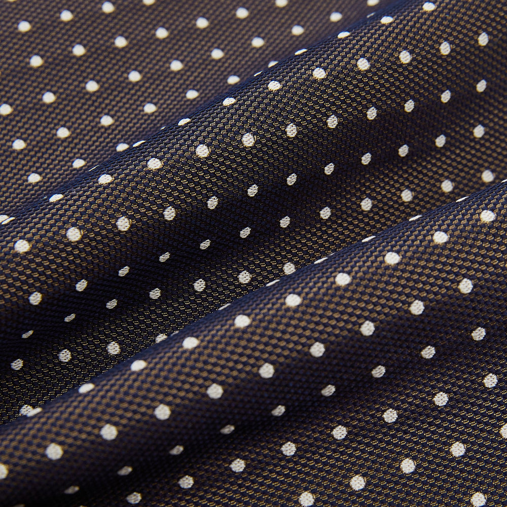 The White and Brown Micro Dot Silk Cravat from Turnbull & Asser adds refined style to any outfit with its subtle dotted pattern and luxurious silk fabric.