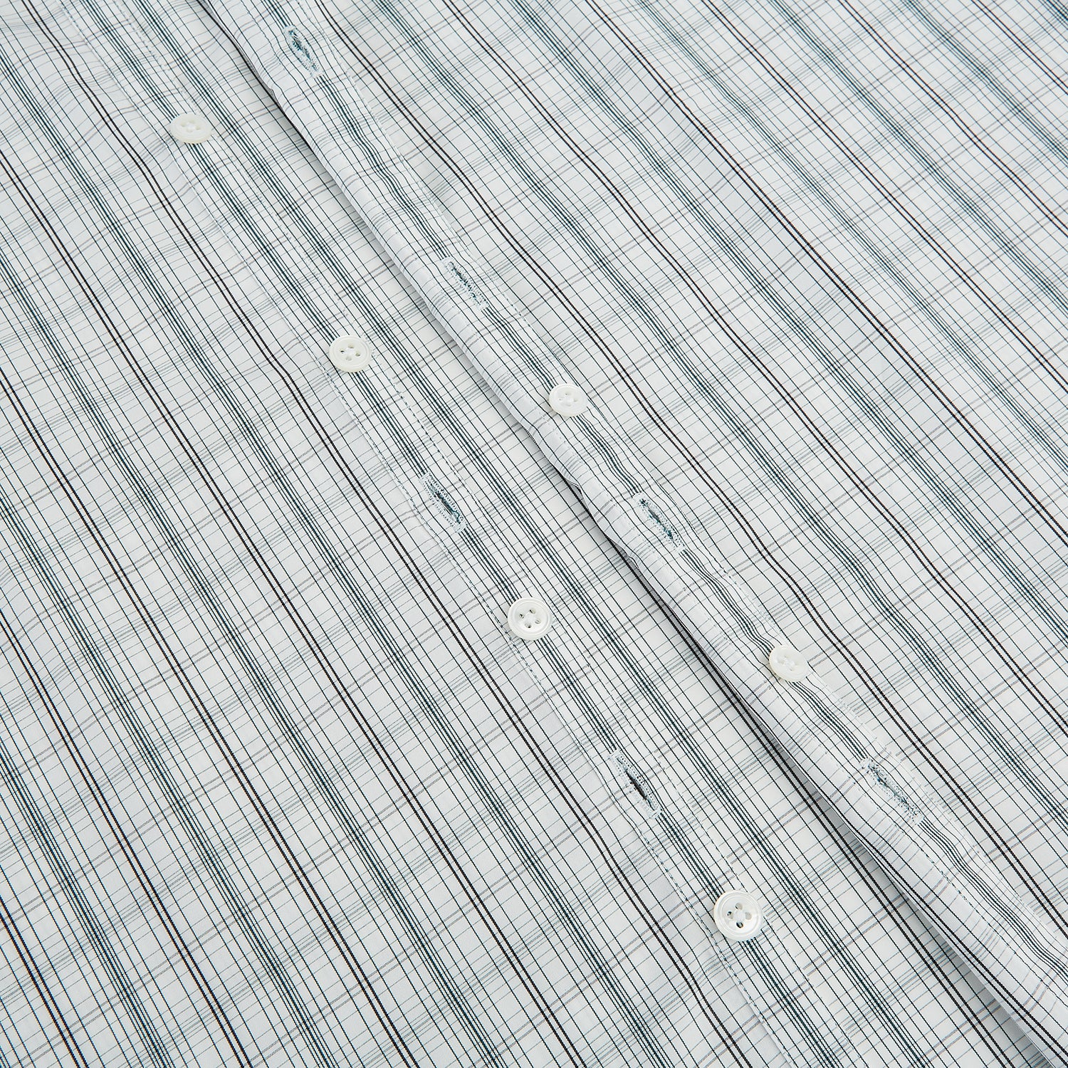 View 7 of product The Turnbull & Asser Forest Green Multi Check Westminster Shirt is a tailored, long-sleeved, button-up shirt with a collar and a white base featuring light blue and green plaid, displayed flat on a white background.