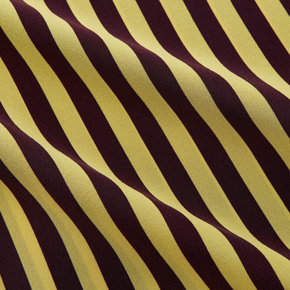 The Turnbull & Asser Yellow and Burgundy Candy Stripe Silk Weekend Fit Harold Shirt features long sleeves, a classic collar, white buttons, and a tailored design.