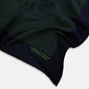 View 2 of product The Navy and Fern Green Stripe Silk Pocket Square by Turnbull & Asser features green vertical and diagonal stripes, hand-rolled edges, and "TURNBULL & ASSER HAND PRINTED IN ENGLAND" printed in one corner.
