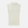 View 1 of product The Ecru Fine Merino V-Neck Vest by Turnbull & Asser is a sleeveless gentleman’s sweater with ribbed edges in cream knit, shown against a plain white background.