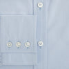 View 4 of product The Pale Blue Mayfair Shirt by Turnbull & Asser is a long-sleeve, button-up dress shirt with a pointed collar and buttoned cuffs, crafted from sanforised cotton and shown laid flat on a white background.