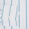 View 4 of product The Turnbull & Asser Turquoise Track Stripe Mayfair Shirt is crafted from Italian cotton with long sleeves, turquoise vertical stripes, a classic collar, and buttoned cuffs, displayed on a plain white background.
