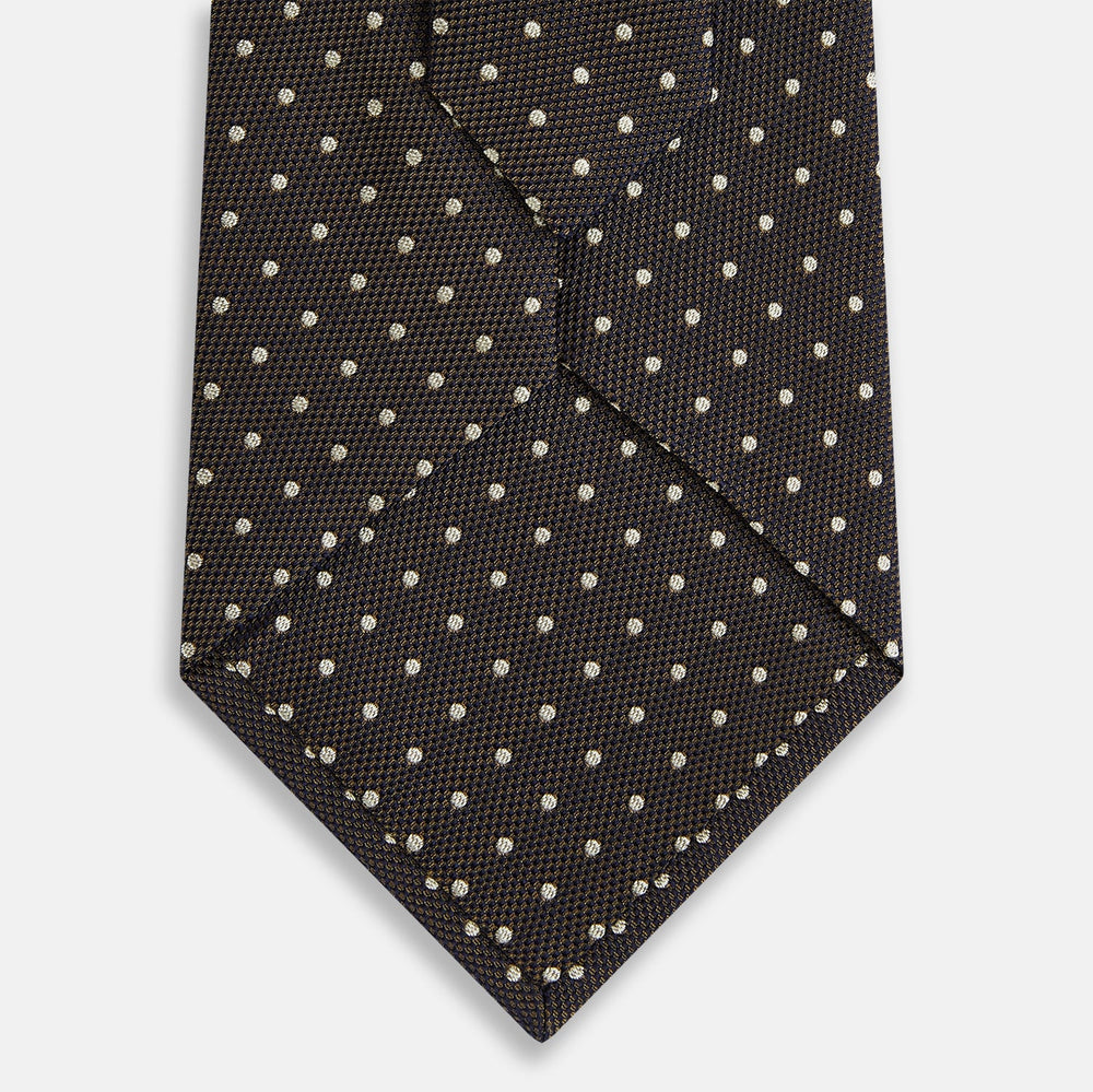 The Turnbull & Asser White and Brown Micro Dot Silk Tie features a refined micro dot pattern—an essential accessory for any men's wardrobe.