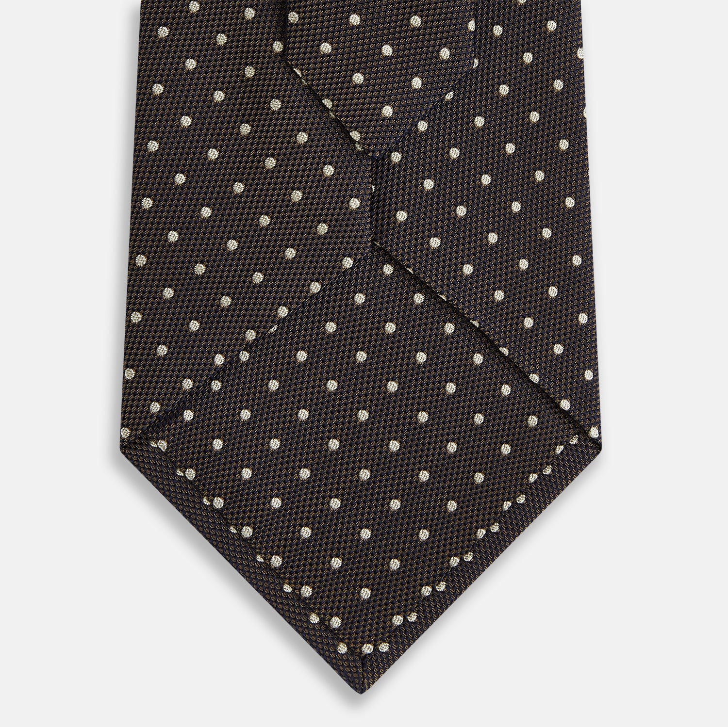 View 3 of product The Turnbull & Asser White and Brown Micro Dot Silk Tie features a refined micro dot pattern—an essential accessory for any men's wardrobe.
