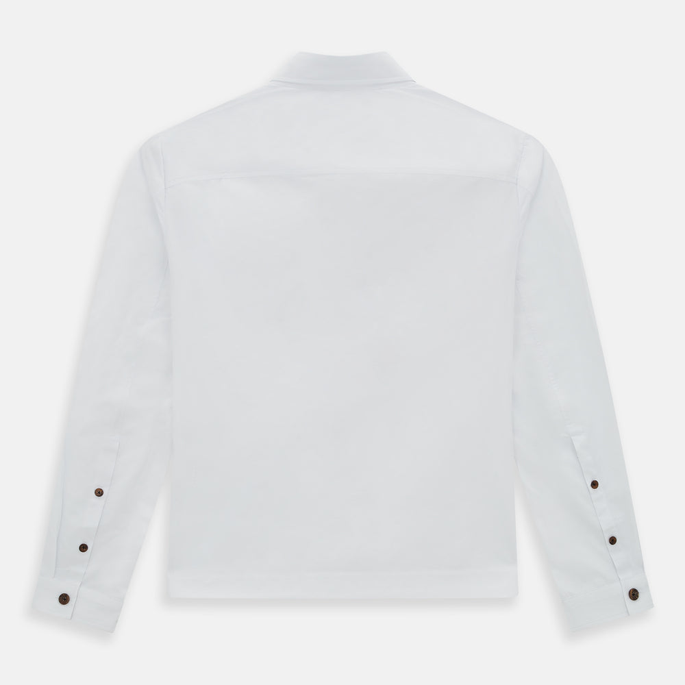 The White Hyde Overshirt by Turnbull & Asser is crafted from sanforised cotton with a left chest pocket and dark buttons—offering a sharp, casual blazer alternative. Shown laid flat on a white background.